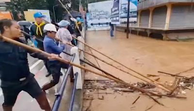 At least two dead, hundreds stranded in Thailand as floods hit north