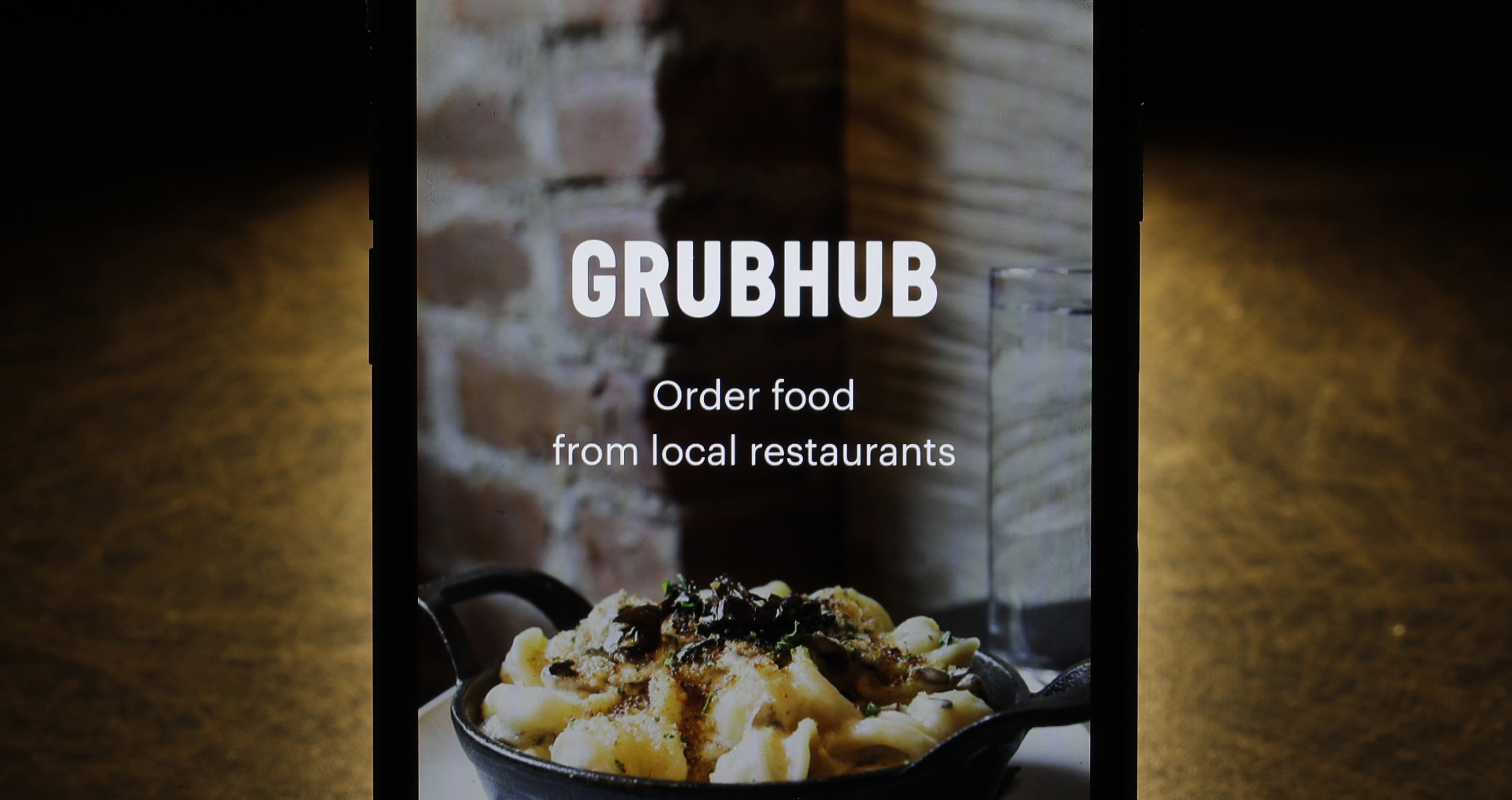 Amazon expands Grubhub deal in food delivery push