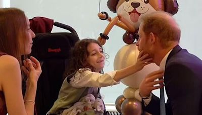 Prince Harry upstaged by 'boisterous' little boy during charity event in London