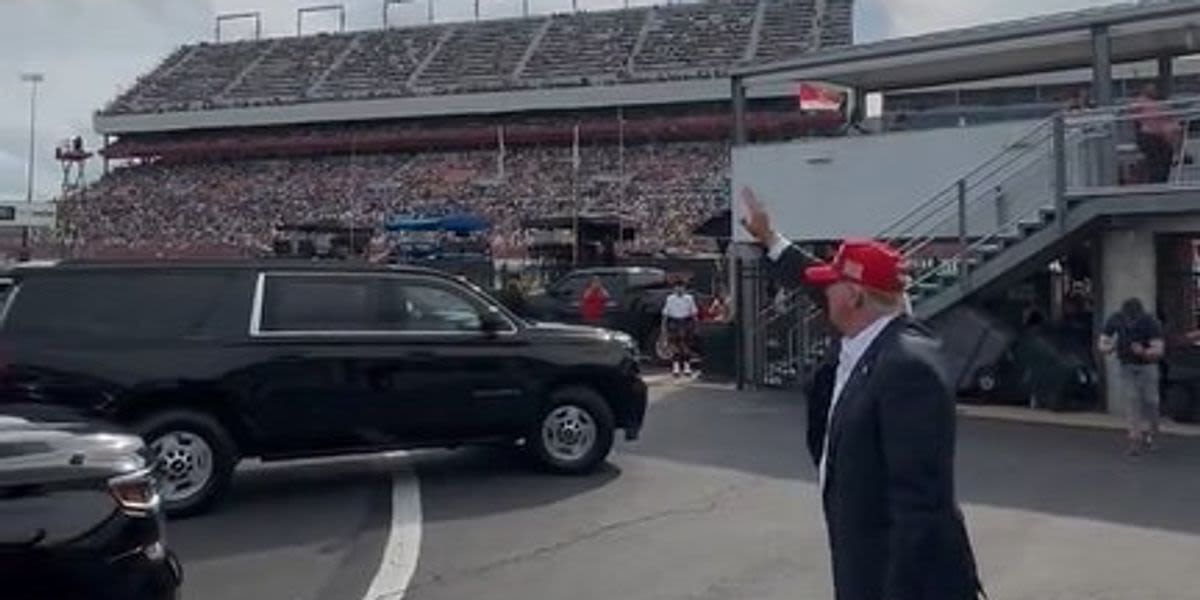 'Stage the moment': Trump accused of being 'caught waving at a non-existent audience'
