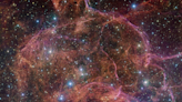 Ghost of a dead star glows pink in new Very Large Telescope image