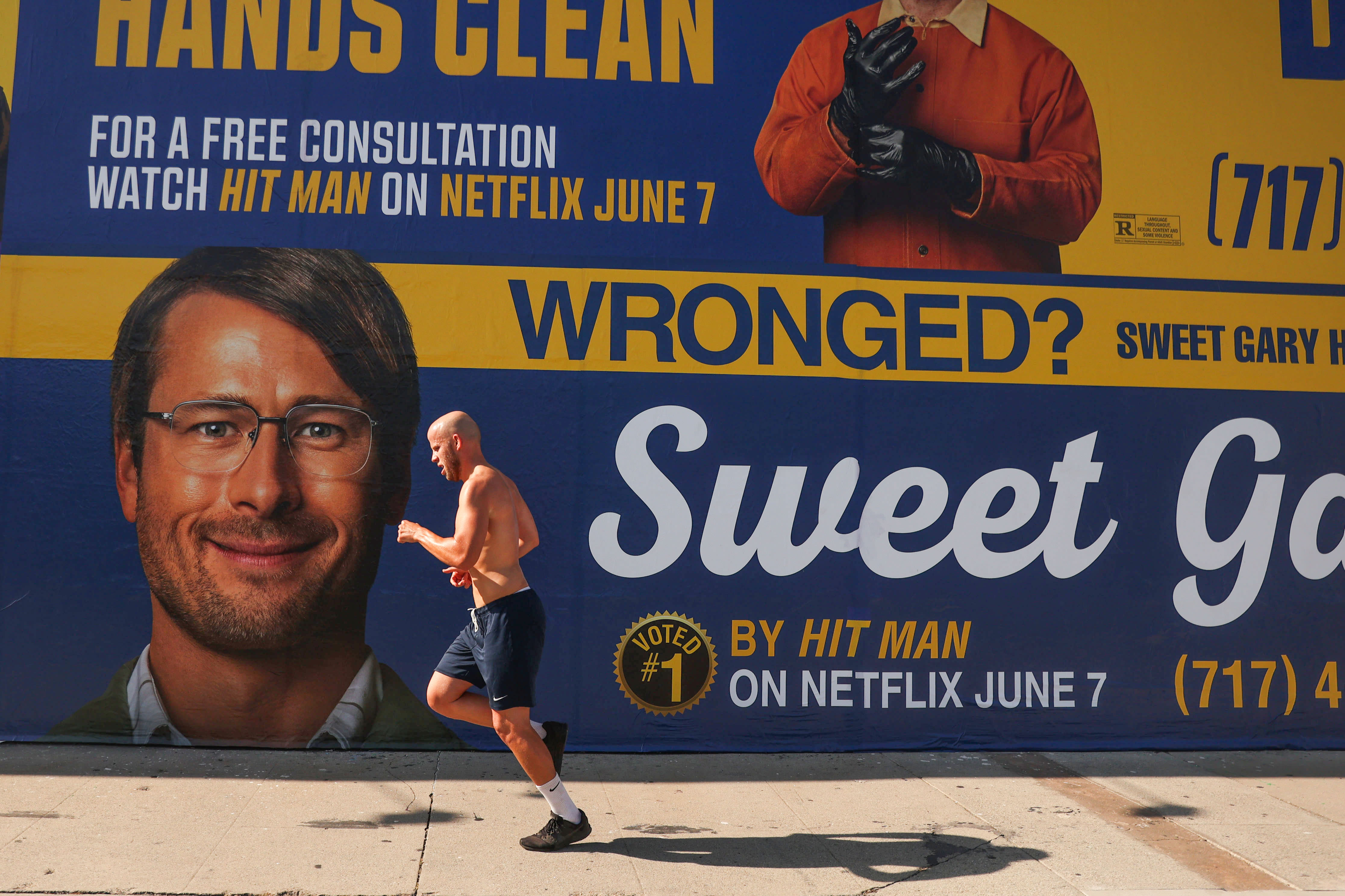 Need a 'Hit Man'? Netflix spoofs L.A.’s famous lawyer billboards to market new movie