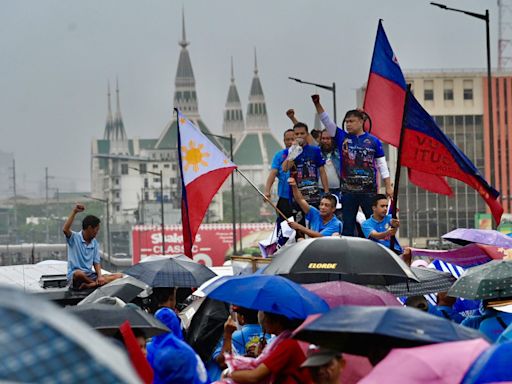 Undeterred by downpour, groups march to reject Marcos’ Bagong Pilipinas