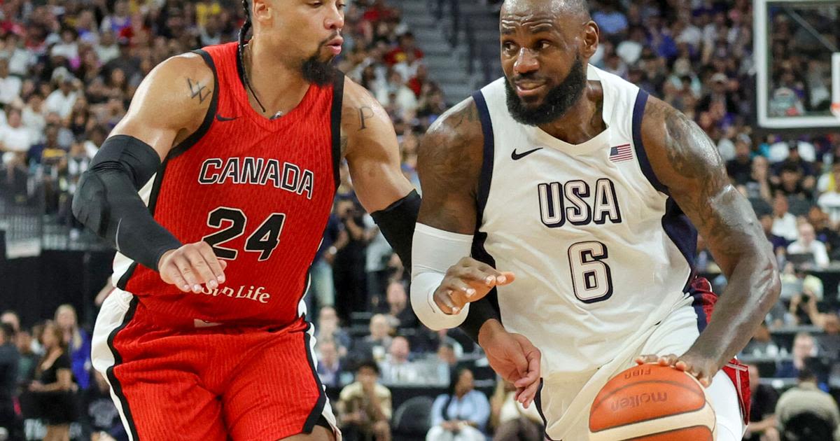 The United States' LeBron James drives against Canada's Dillon Brooks in the second half of an exhibition game ahead of the Paris Olympic Games, at T-Mobile...