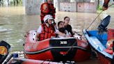 Rains lash southern China as rising rivers threaten more flooding