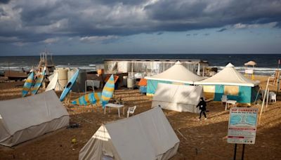 As Israeli Jets Hit Beirut, People Flee To Sleep On The Beach