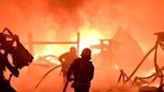 Firefighters try to douse a blaze sparked by a Russian drone attack