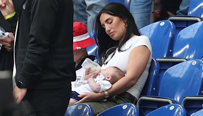 Kyle Walker’s wife Annie Kilner feeds their baby at England’s Euros game