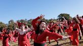 Kate Bush fans gather in red dresses for ‘The Most Wuthering Heights Day Ever’