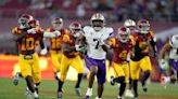 Johnson runs for 256 yards, 4 TDs in No. 5 Washington's high-octane 52-42 win over No. 24 USC