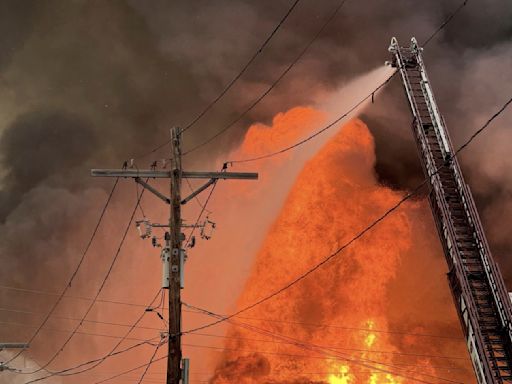 2 fire tanker trucks heading to large warehouse blaze crash, injuring 7 firefighters