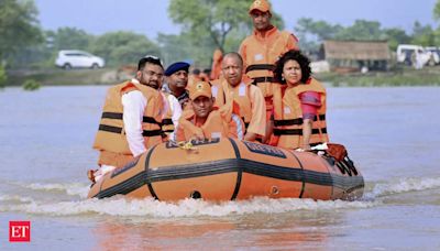 UP CM Yogi Adityanath inspects flood-affected areas in Shravasti; distributes relief materials - The Economic Times