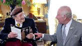 King presents D-Day veteran with 100th birthday card at Buckingham Palace