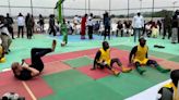 Prince Harry enjoys game of sitting volleyball as Meghan cheers him on during Nigeria visit