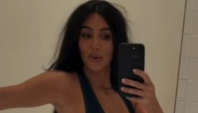 Kim Kardashian struggles to close bodysuit and enlists Khloe's help