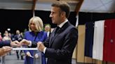 Emmanuel Macron votes in French legislative elections that could force him to share power with the far right