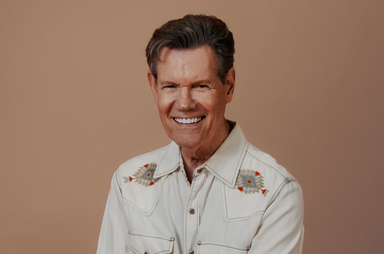 Randy Travis Thanks Fans For Putting Him ‘Back in the Saddle Again’ After Release of AI-Assisted Single ‘Where That...