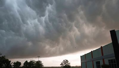 Tornado overturns trucks and damages homes as Texas and Oklahoma residents told to seek shelter