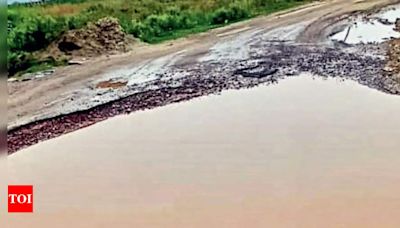 Rains leave a mark: Key link from NH-9 dotted with craters in Ghaziabad | Ghaziabad News - Times of India