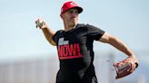 Reds coach Alon Leichman shows off 'Bring Them Home Now!' glove in support of Israel