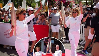 Energized Halle Berry walks Olympic torch down Croisette during Cannes Lions festival