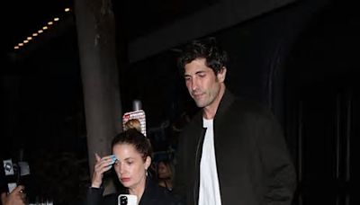 Ashley Benson wows in a tiny black dress as she steps out for a date night with husband Brandon Davis - two months after welcoming first child