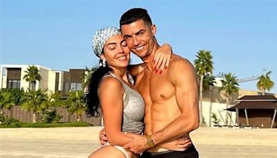 Cristiano Ronaldo poses alongside bikini-clad girlfriend Georgina following suspension