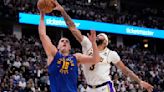 Nikola Jokic leads NBA champ Denver Nuggets past LeBron James and Lakers 114-103 in playoff opener