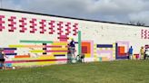 Local artists paint mural on the Margaret Walker Alexander Library