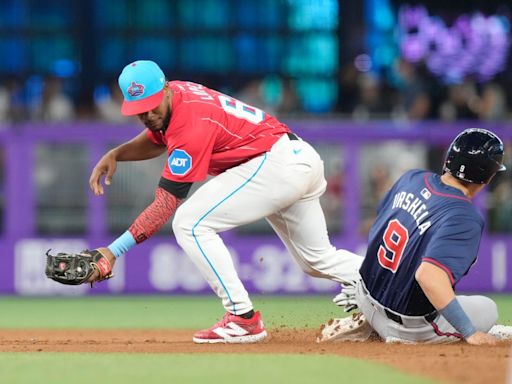 Olson hits tiebreaking homer and Braves beat Marlins to stay two games back of Mets for wild card