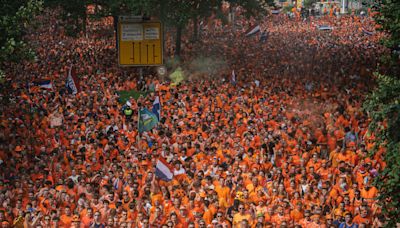 Pounding music, thudding bodies, flares and fun - on the march with the orange army