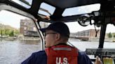 Heavily armed security boats patrol winding Milwaukee River during GOP convention
