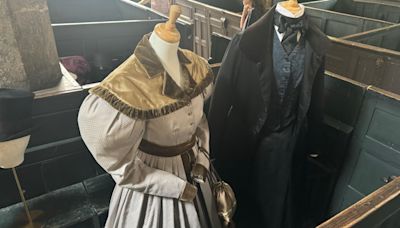 Gentleman Jack costumes displayed at wedding venue