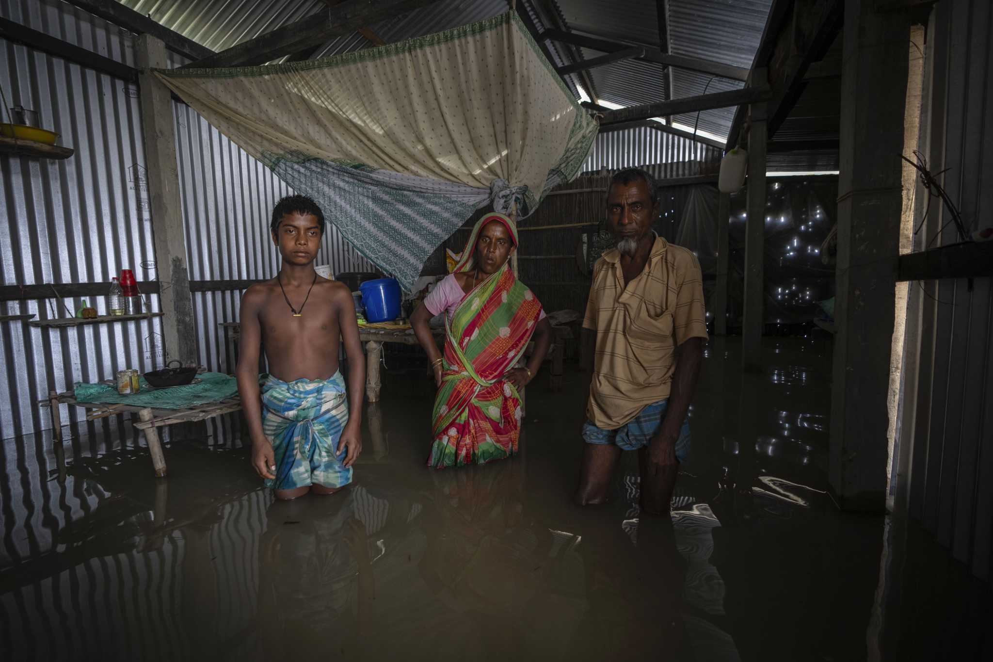 Resigned to a fate of constant displacement, India's river islanders return home in between floods