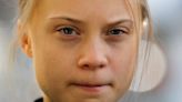 When is Greta Thunberg arriving in Davos and why is she protesting the World Economic Forum?