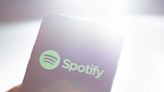 Spotify cancels 11 original podcasts, lays off under 5% of staff