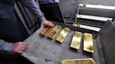 Gold in tight range with US economic data on tap