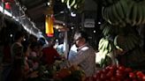 India's retail inflation reignites in June as food prices surge