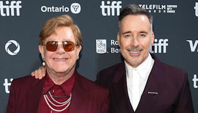 Elton John Walks TIFF Red Carpet with Husband David Furnish After Revealing He Has 'Only Limited Vision in One Eye'