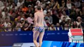 Paris 2024 volunteer wearing colourful swimming trunks saves the day