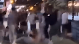 Moment lesbian couple are beaten by mob in 'homophobic attack' on night out