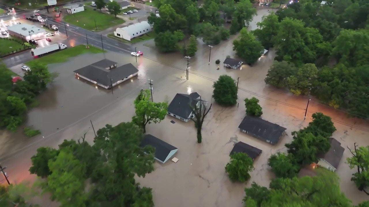 Drone video shows Texas town underwater as boats rescue residents trapped in homes