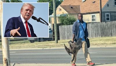 Ohio officials reveal why man in viral photo was holding two geese