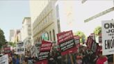 San Francisco hotel workers and janitors march on May Day for better pay, healthcare