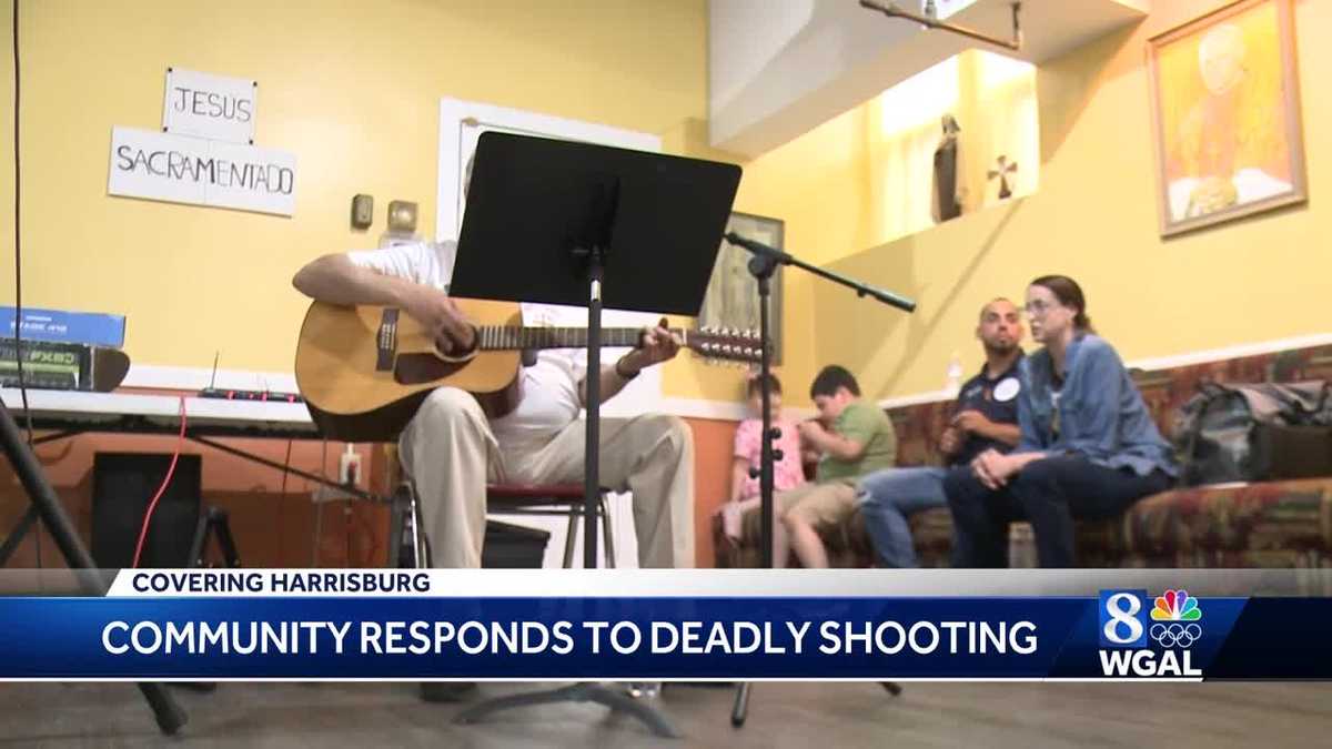 Parishioners attending St. Francis of Assisi Catholic Church react to Tuesday's mass shooting