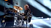 Def Leppard’s one-armed drummer Rick Allen tackled to the floor by teen football star