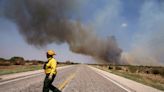 Wildfire burns homes around lake in Texas amid high heat