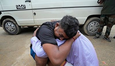 Stampede kills more than 100 worshipers at a religious gathering in India