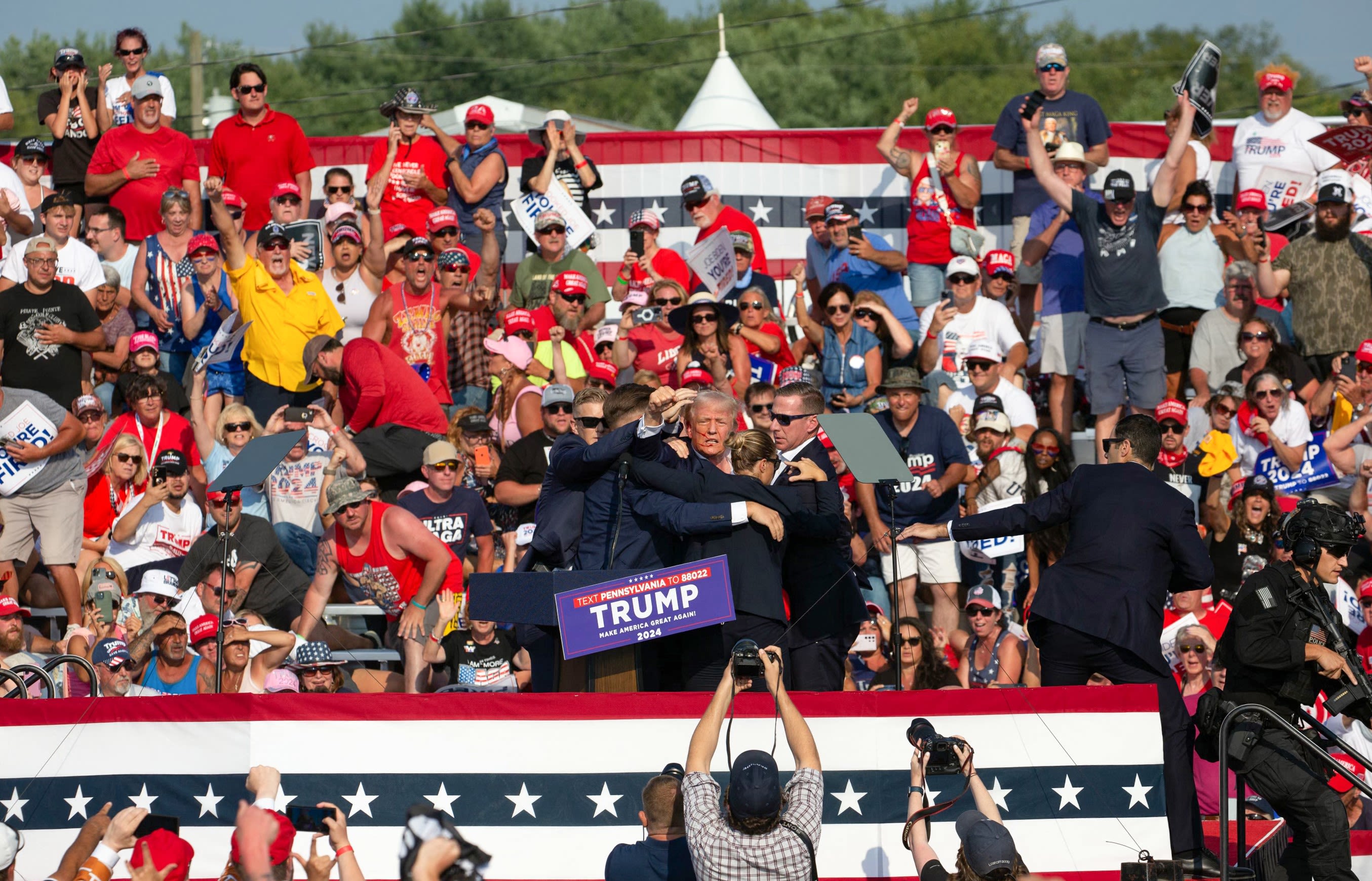 Woman behind Donald Trump during shooting comes under scrutiny