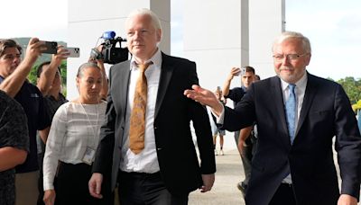 Julian Assange walks free from court after pleading guilty in US deal